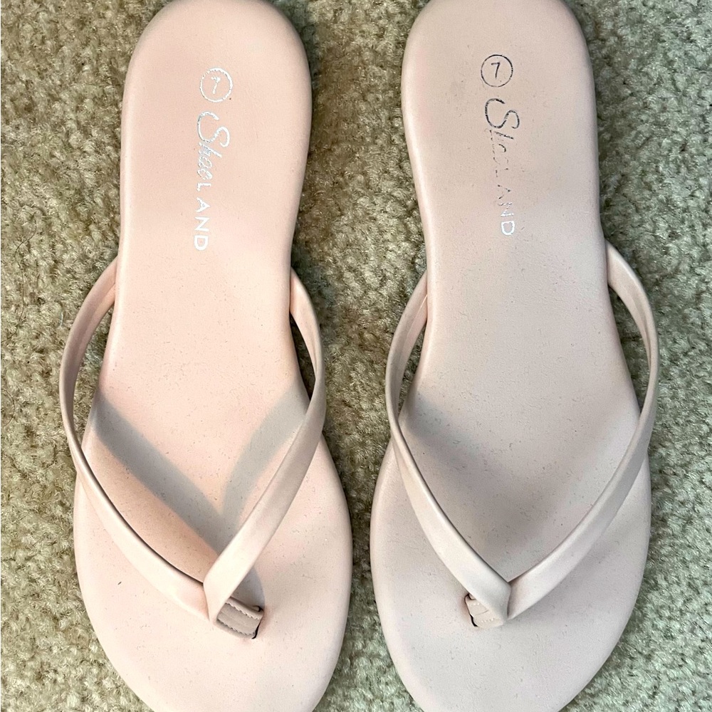 Tan flip flops
